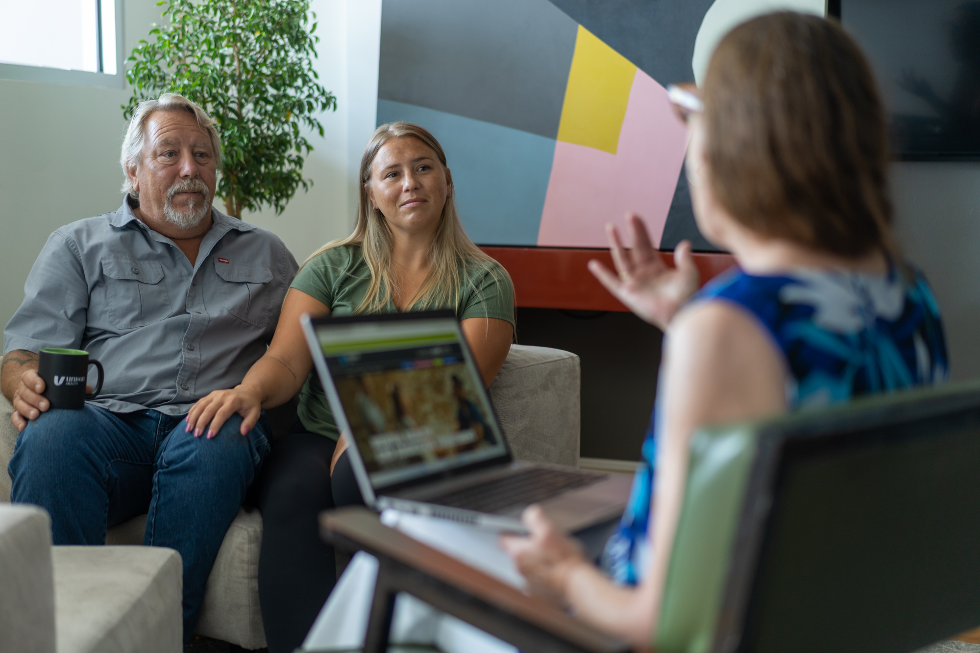 housing team meeting with adult clients to discuss supportive housing programs