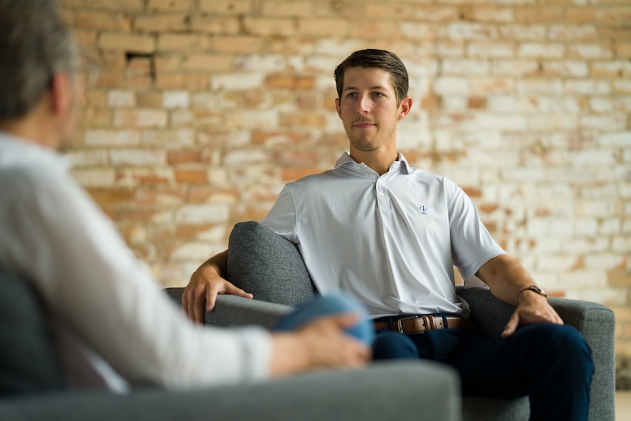 Unison adult client speaking with therapist in mental health session